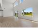 Open living space with large windows and sliding glass doors at 107 Hampton Loop, Davenport, FL 33837