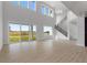 Two-story living room with lots of natural light and high ceilings at 107 Hampton Loop, Davenport, FL 33837