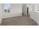 Loft bedroom with carpet and access to bathroom at 107 Hampton Loop, Davenport, FL 33837