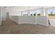 Bright loft hallway with carpet and multiple windows at 107 Hampton Loop, Davenport, FL 33837