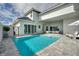 Inviting rectangular pool with gray tile deck and lounge chairs at 107 Hampton Loop, Davenport, FL 33837
