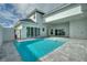 Inviting rectangular pool with gray tile deck and lounge chairs at 107 Hampton Loop, Davenport, FL 33837