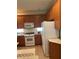 Functional kitchen with ample cabinet space and appliances including a white refrigerator and oven at 11774 Via Lucerna Cir, Windermere, FL 34786