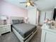 Relaxing bedroom features queen bed, carpeted floors, and soft lighting at 1612 Herrons Green Path, Kissimmee, FL 34747
