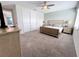 Spacious carpeted bedroom featuring a large closet and ample space for relaxation and rest at 1612 Herrons Green Path, Kissimmee, FL 34747