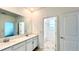 Bathroom with double vanity and a tub at 17112 Salty Dog Rd, Winter Garden, FL 34787