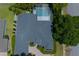 Bird's eye view of home and pool, showcasing the roof and surrounding greenery at 14421 Hatchee Ct, Orlando, FL 32837