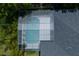 Aerial view of screened in pool and lanai, surrounded by mature trees at 14421 Hatchee Ct, Orlando, FL 32837