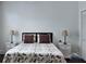 Cozy bedroom featuring a comfortable bed with decorative pillows, side tables, and ample closet space at 14421 Hatchee Ct, Orlando, FL 32837