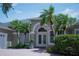 Beautiful single-story home with brick driveway, lush landscaping, and double door entry at 14421 Hatchee Ct, Orlando, FL 32837