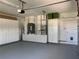 Clean and organized garage with ample storage, cabinets, and modern features for added convenience at 14421 Hatchee Ct, Orlando, FL 32837