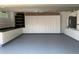 Well-organized garage with extensive storage cabinets, work area, and plenty of space for vehicles at 14421 Hatchee Ct, Orlando, FL 32837