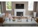 Cozy living room with a white fireplace and white sofa at 14421 Hatchee Ct, Orlando, FL 32837