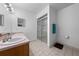 Bathroom with a double sink vanity and glass-enclosed shower at 1775 Sundance Dr, St Cloud, FL 34771