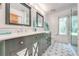 Bathroom featuring a double vanity, modern fixtures, and stylish tile flooring at 1775 Sundance Dr, St Cloud, FL 34771
