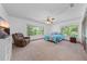 Bright bedroom with a ceiling fan, lush views, and comfortable furniture at 1775 Sundance Dr, St Cloud, FL 34771