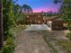 Beautiful two-story brick home with well-maintained landscaping and a long driveway at 1775 Sundance Dr, St Cloud, FL 34771