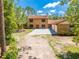 Lovely two-story brick home with mature trees and a spacious driveway at 1775 Sundance Dr, St Cloud, FL 34771