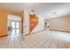Open foyer with tile flooring and an adjacent living area at 1775 Sundance Dr, St Cloud, FL 34771