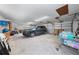 Spacious garage featuring ample storage space and a car at 1775 Sundance Dr, St Cloud, FL 34771