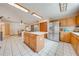 Kitchen with stainless steel appliances, island, and eat-in area at 1775 Sundance Dr, St Cloud, FL 34771