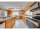This spacious kitchen features ample counter space, stainless steel appliances, and light wood cabinetry at 1775 Sundance Dr, St Cloud, FL 34771