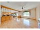Open-concept living area with hardwood floors, a brick fireplace, and views of the backyard at 1775 Sundance Dr, St Cloud, FL 34771