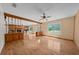 Open living room with hardwood floors, a fireplace and backyard views at 1775 Sundance Dr, St Cloud, FL 34771