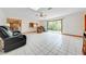 Spacious living room with tile floors and a view of the backyard at 1775 Sundance Dr, St Cloud, FL 34771