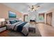 Spacious main bedroom with a king-size bed and lots of natural light at 1775 Sundance Dr, St Cloud, FL 34771