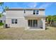 View of the home's backyard featuring a covered patio and sliding glass doors at 500 Summit River Dr, Apopka, FL 32712