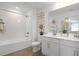 Stylish bathroom featuring a tub/shower combination and double sinks at 500 Summit River Dr, Apopka, FL 32712