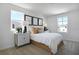 Bright bedroom with large windows, neutral carpet, and a comfortable bed at 500 Summit River Dr, Apopka, FL 32712