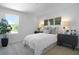 Bedroom features neutral carpet, a large window, and unique decorations at 500 Summit River Dr, Apopka, FL 32712