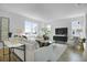 Bright and airy living room with comfortable seating, a large window, and stylish decor at 500 Summit River Dr, Apopka, FL 32712