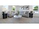 Cozy living room featuring a comfortable sectional sofa, marble coffee table, and stylish decor at 500 Summit River Dr, Apopka, FL 32712