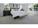 Bright main bedroom features large windows, neutral carpet, and stylish decor at 500 Summit River Dr, Apopka, FL 32712