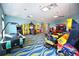 Spacious game room with various arcade and game machines at 1077 Quaker Ridge Ln, Davenport, FL 33896