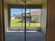 Covered lanai overlooking the lawn and neighborhood at 1077 Quaker Ridge Ln, Davenport, FL 33896