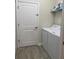 Laundry room featuring a washer and dryer and a wire rack shelf at 1077 Quaker Ridge Ln, Davenport, FL 33896