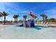 Splash pool area with slides, a bucket drop, and lounge chairs at 1077 Quaker Ridge Ln, Davenport, FL 33896
