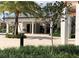 Poolside restroom facilities surrounded by attractive landscaping, creating a functional yet aesthetically pleasing space at 1077 Quaker Ridge Ln, Davenport, FL 33896