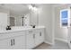 This bright bathroom has a dual sink vanity with modern fixtures and an adjacent private lavatory at 199 Bull Frog Ln, Umatilla, FL 32784