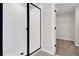 Modern bathroom showcasing an all-glass shower with a black frame and adjacent closet at 199 Bull Frog Ln, Umatilla, FL 32784