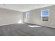 This bedroom offers a neutral palette, plush carpet, and bright windows that add lots of natural light at 199 Bull Frog Ln, Umatilla, FL 32784