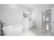 Bathroom featuring a freestanding bathtub and marble flooring at 458 Bar Ct, Kissimmee, FL 34759