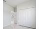 Bedroom with double door closet and view to living area at 458 Bar Ct, Kissimmee, FL 34759