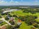 An aerial view shows the home and surrounding neighborhood, showcasing the area and the property's location at 319 Water Shore Dr, Leesburg, FL 34748