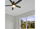 Bedroom featuring a ceiling fan, window and a view of the outdoors at 319 Water Shore Dr, Leesburg, FL 34748