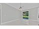Bright room showcasing a sliding glass door that fills the room with light at 319 Water Shore Dr, Leesburg, FL 34748